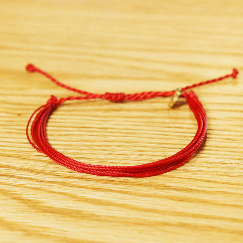 PULSERA AJUSTABLE HILO ENCERADO “COSMICA ORIGINAL ROJO”